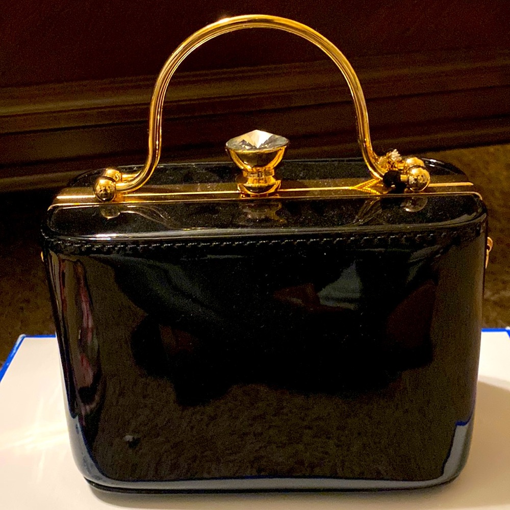 New black and gold hand purse